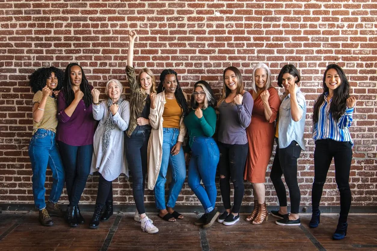 Co-workers high-five at a conference table